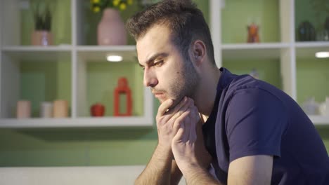 young man thinking thoughtfully depressed.