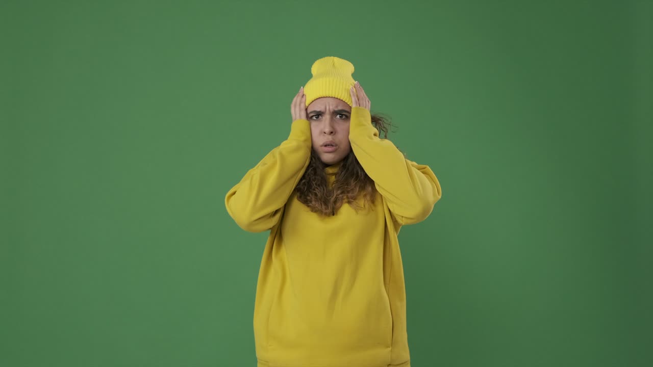 Worried woman covering her face with hands
