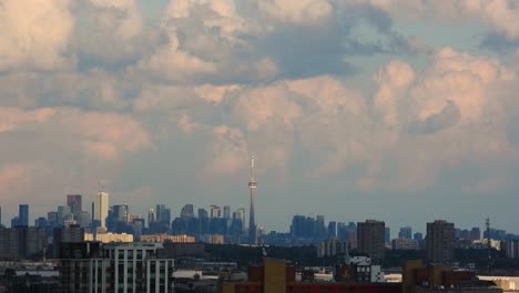 time lapse shot of heavy clouds moving fast above toronto skyline, canada