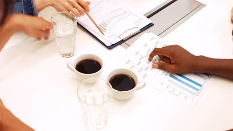 male and female business executives interacting with each other in a meeting