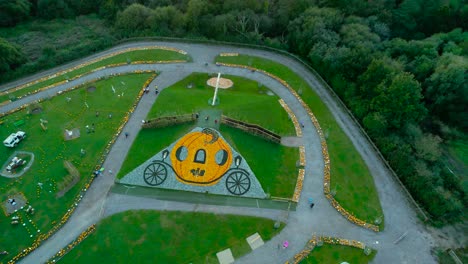 Fairy-tale-carriage-made-from-individual-Halloween-pumpkins-attraction-aerial-view-across-Southampton-farming-garden-vegetation