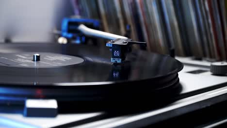 vinyl record player on the background of records