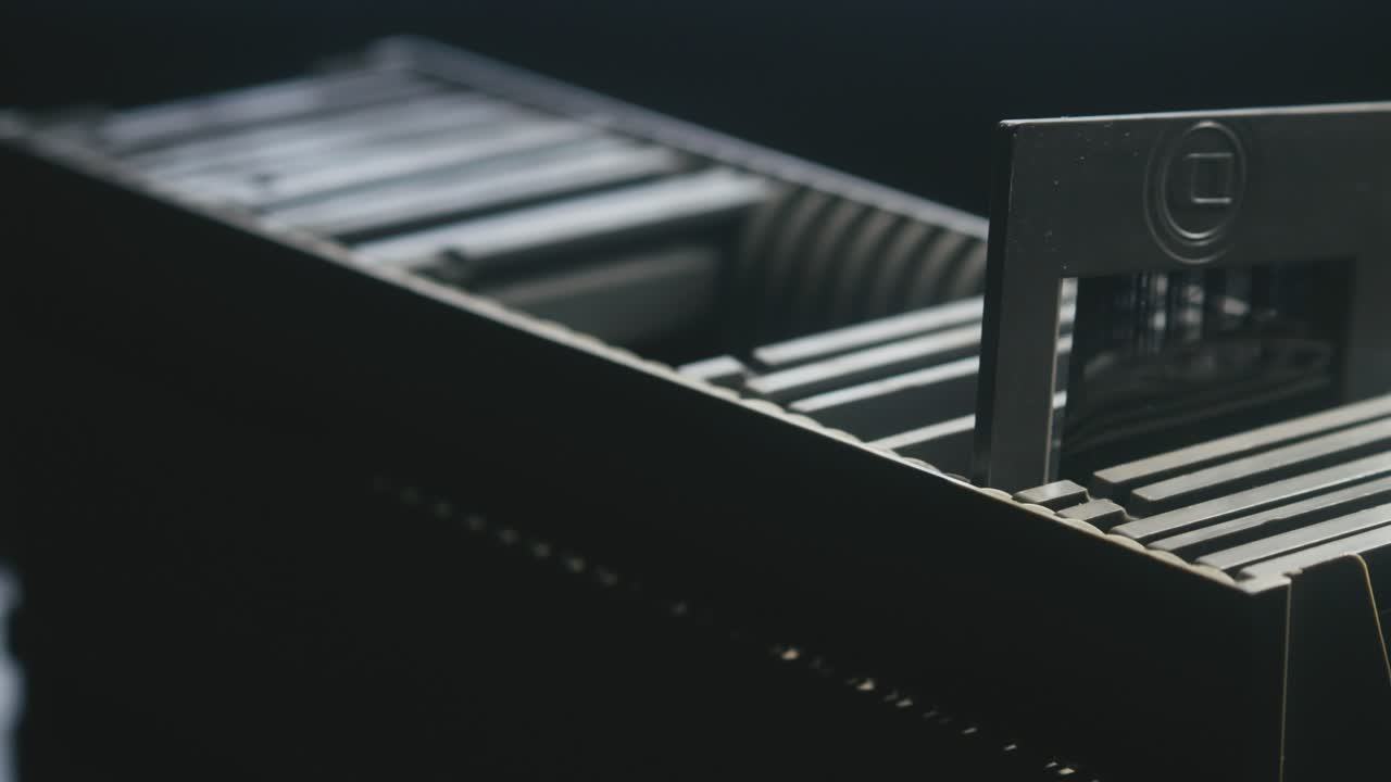 Photo slide show storage case with diapositive film. CLOSE-UP SLIDE