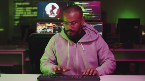 Young Man Working On Code
