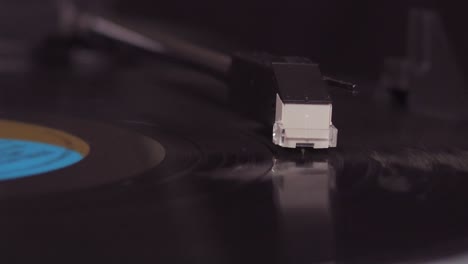 loopable stylus needle on vinyl record, infinite spinning lp player, close-up shot, record needle stylus head, 4k loop