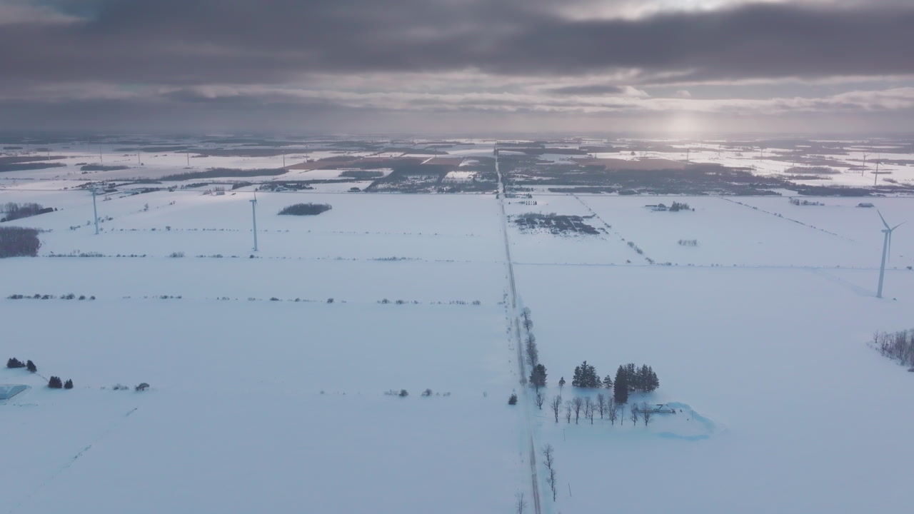 Wind turbines in snowy Shelburne, showing winter's icy landscape
