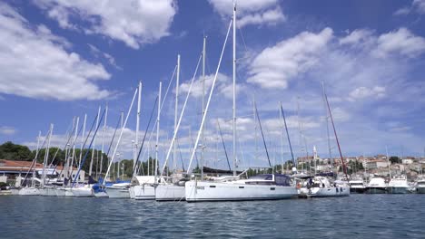 White-yachts-on-an-anchor-in-the-marina,-vacation,-luxury