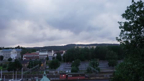Landscape-Shot-of-Boras-Sweden-at-The-Central-Station-and-The-Forest-In-The-Background-on-a-Grey-Cloudy-Evening