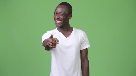 young african man pointing at camera