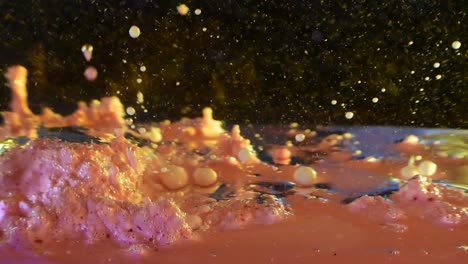 alien planet liquid surface creating large bubble exploding to reveal milky smaller orbs forming and shooting out 60fps