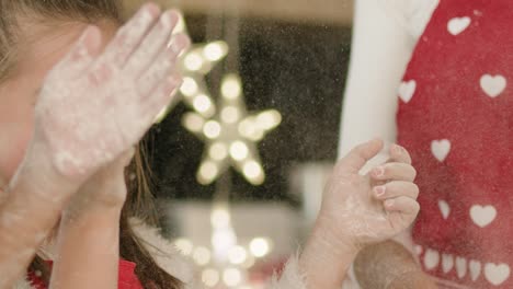 Happy-girl-having-fun-with-flour-in-the-kitchen