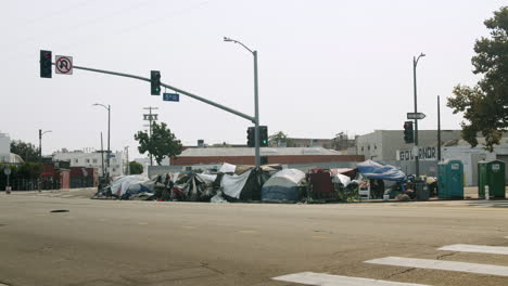 homeless encampment on a city street corner