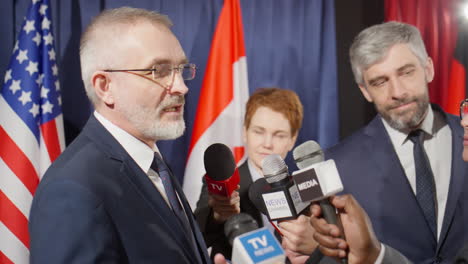 senior politician giving interview to reporters