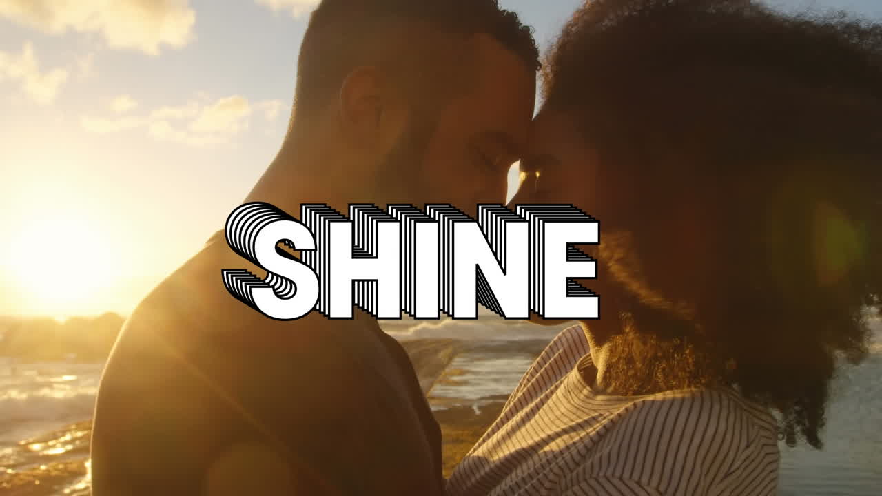 Animation of shine text over couple on the beach
