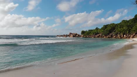 aerial view of the white beaches and turquoise waters at anse coco, petit anse and grand anse on la digue, an island of the seychelles