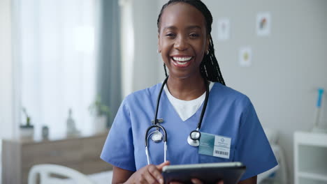 happy nurse with tablet