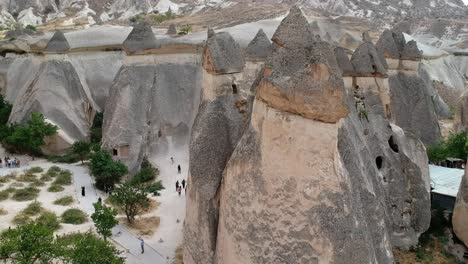 cappadocia turkish goreme volcanic rock formation ancient conical town aerial pull back view