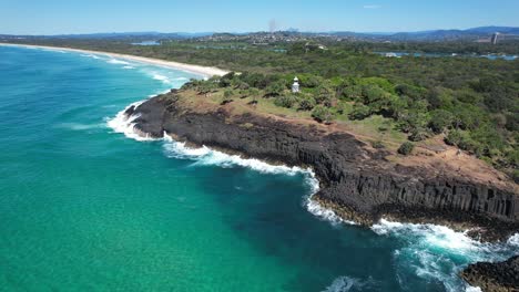 aerial view over fingal head lighthouse in new south wales, australia - drone shot