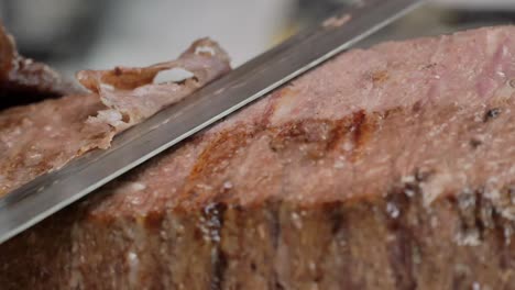 slicing a shawarma