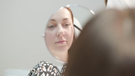 woman preparing for cosmetologist procedure at beauty clinic