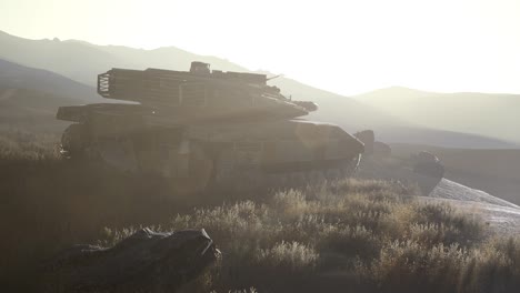 old rusty tank in the desert at sunset