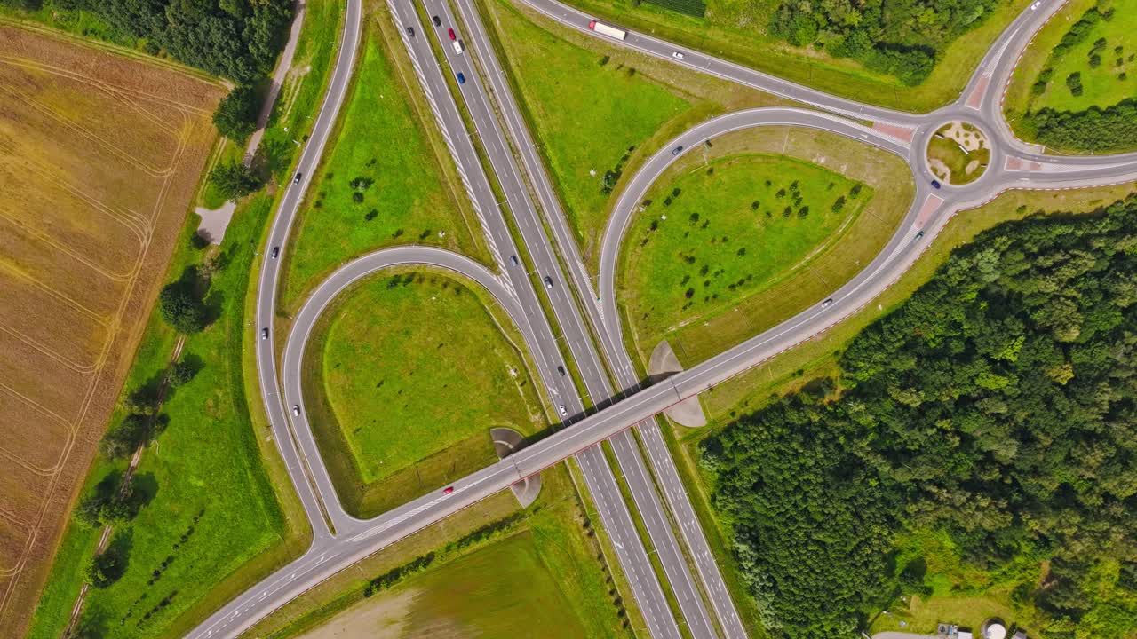 Drone rotate clockwise above highway junction, Paslek North Poland showing roads