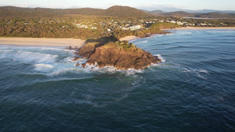 Aerial-View-Of-Norries-Headland-In-New-South-Wales,-Australia-At-Sunset---drone-pullback