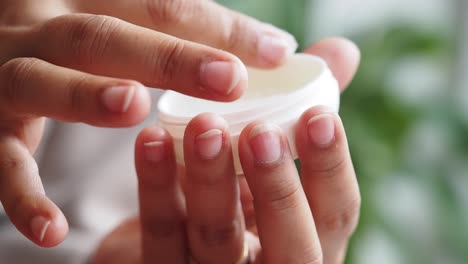 applying cream to hands
