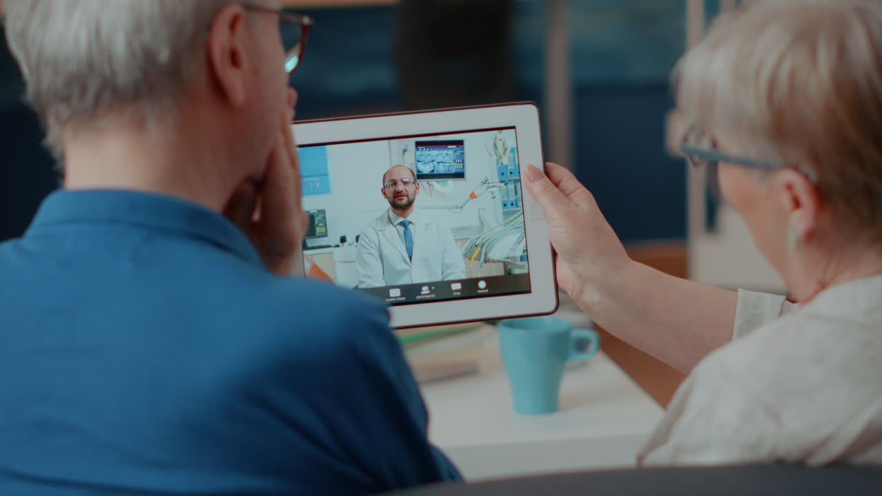 Elderly Couple Using Tablet for Telehealth Consultation
