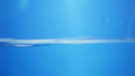 water splashing against a surface with transparent bubbles floating, symbolizing freshness, cleanliness, and fluidity. perfect for background overlays.
