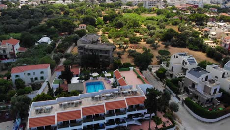 apartments and beach hotels of ialysos town on rhodes, greece - aerial drone shot