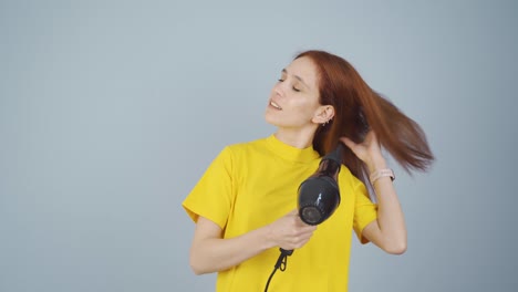 Woman-blow-drying-her-hair.