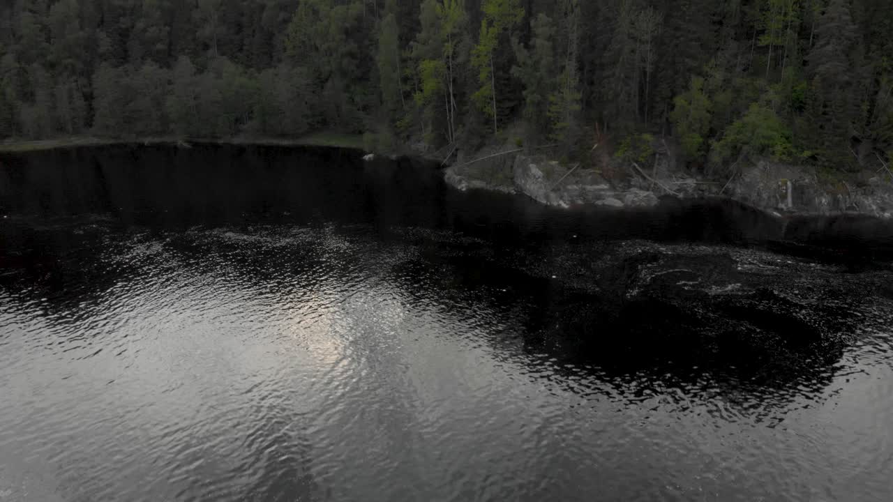 Drone flying top speed over water and climbs at the end