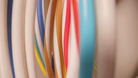 gymnastic hoops and sport equipment at gym, close up