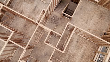 aerial of a house in mid construction, still needs a roof