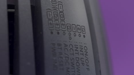 close-up of a device with on/off and up/down buttons.