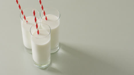 video of three glasses of milk on white background