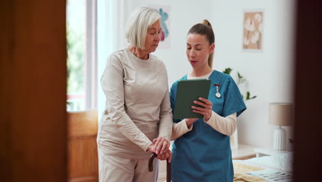 home, senior woman and nurse with a tablet