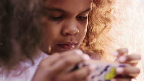 close-up of a young girl playing with something