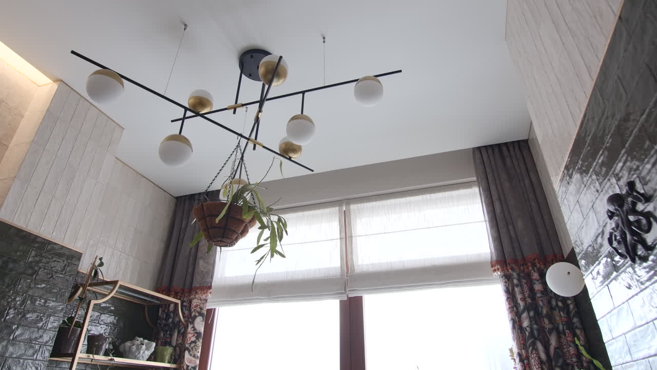 Modern Kitchen Interior with Chandelier and Plants