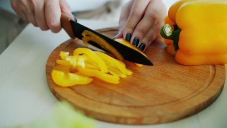 chopping a yellow bell pepper