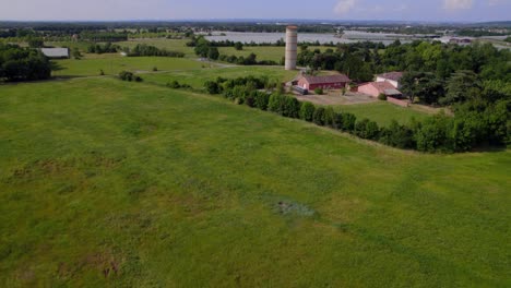 farm fields outside montauban southern france with greenhouses, aerial tilt up reveal shot