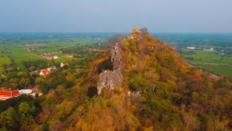 hiking to a statue on top of a mountain with view surrounded by rice fields