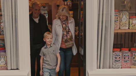 family visiting a candy shop