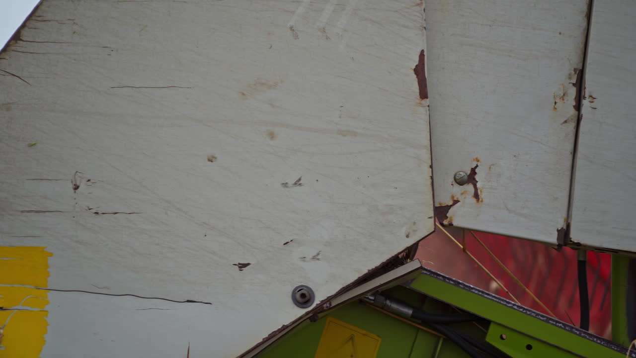 Big combine harvesting golden wheat. Agricultural cereal farming fields.