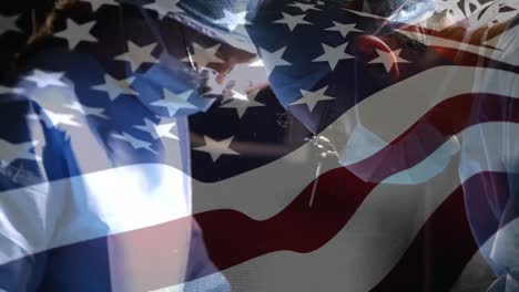 animation of flag of usa waving over surgeons in face masks