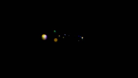 a close-up of the lens of a video camera. the light source illuminates the lenses, then goes into darkness