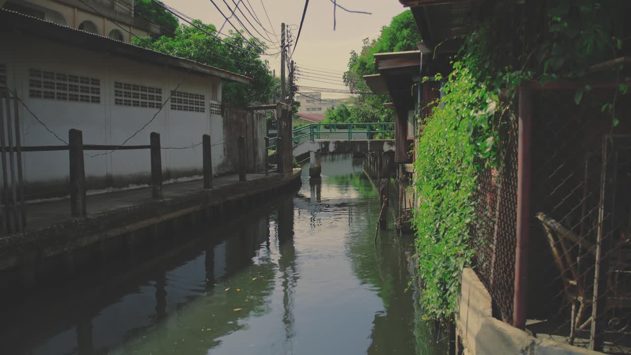 Reflections Over Canals In The Peaceful Settlements In Bangkok, Thailand. Static Shot