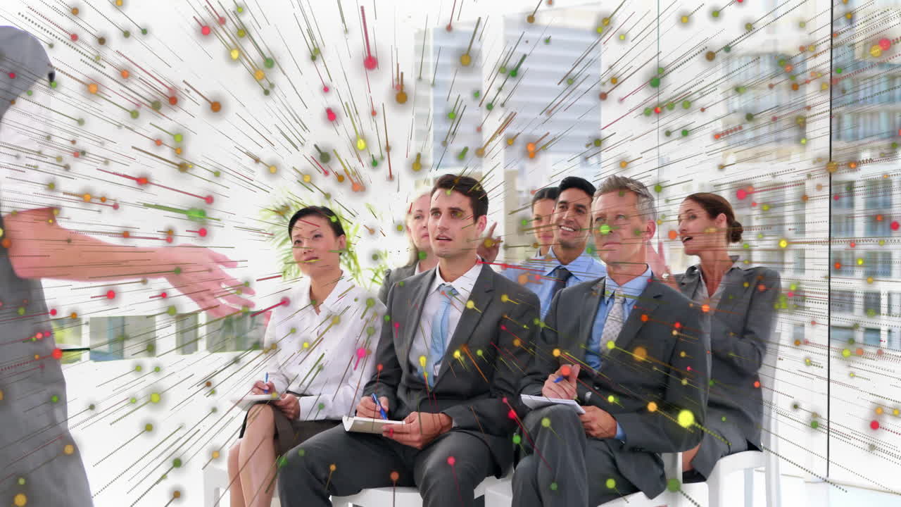 Business professionals in meeting with colorful data visualization animation overlay