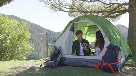Two-people-having-rest-in-tent